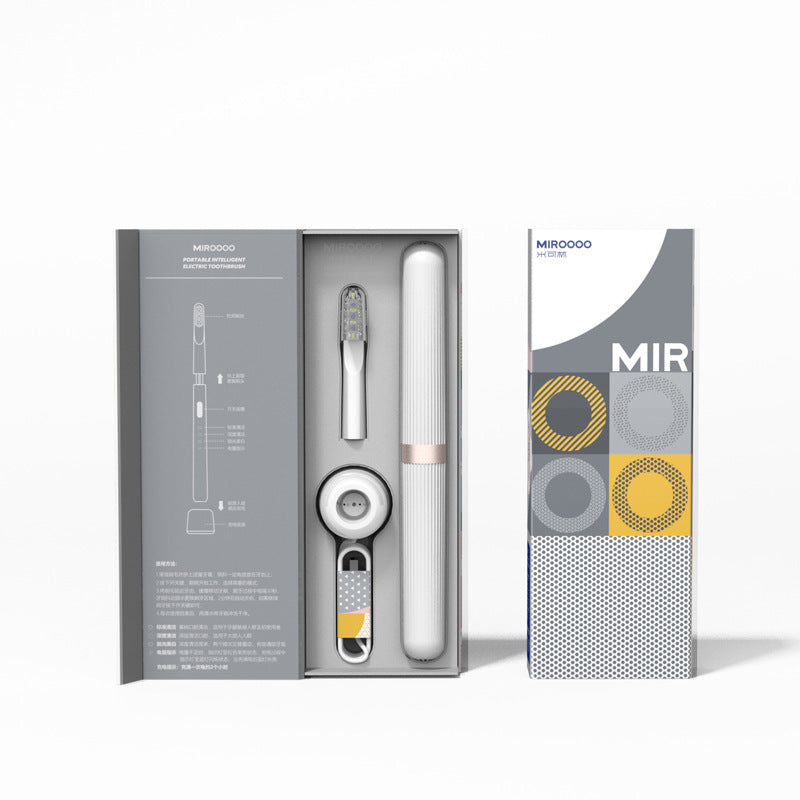 Trekbrush travel electric toothbrush in grey packaging with case and charging dock