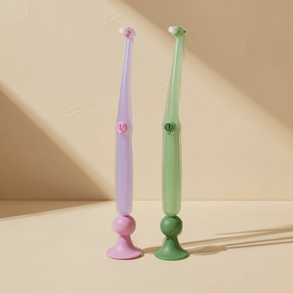 Small-headed interdental brush with soft bristles and attached suction cup