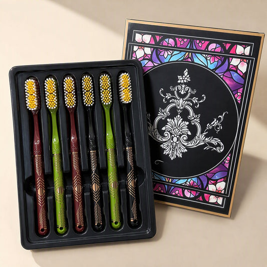 Six adult manual toothbrushes with medium-hard bristles and extended heads arranged beside a gift box