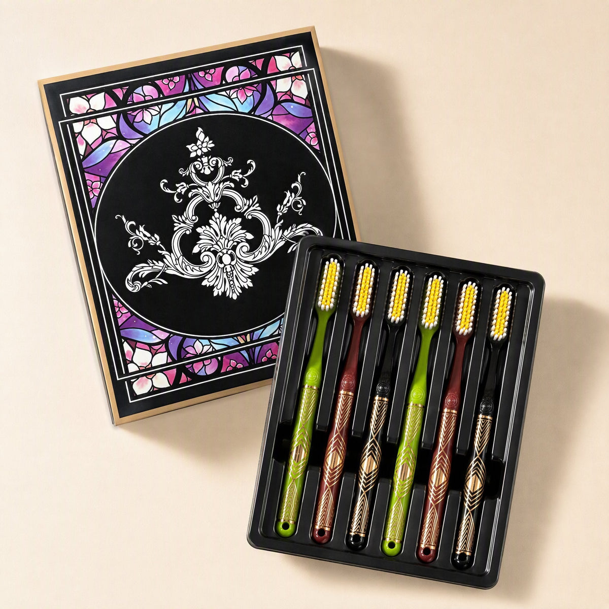 Six adult manual toothbrushes with medium-hard bristles and extended heads arranged beside a gift box - view 2