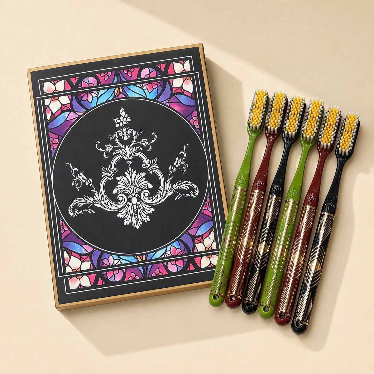 Six adult manual toothbrushes with medium-hard bristles and extended heads arranged beside a gift box - view 3