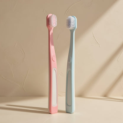 U-shaped manual orthodontic toothbrush with soft fluoride-containing bristles and a small brush head