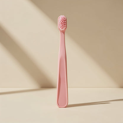 Manual orthodontic toothbrush with a small U-shaped head and soft fluoride-containing bristles