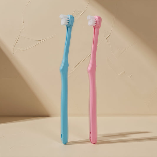 Manual toothbrush with a small head, soft bristles, and a single-tuft design