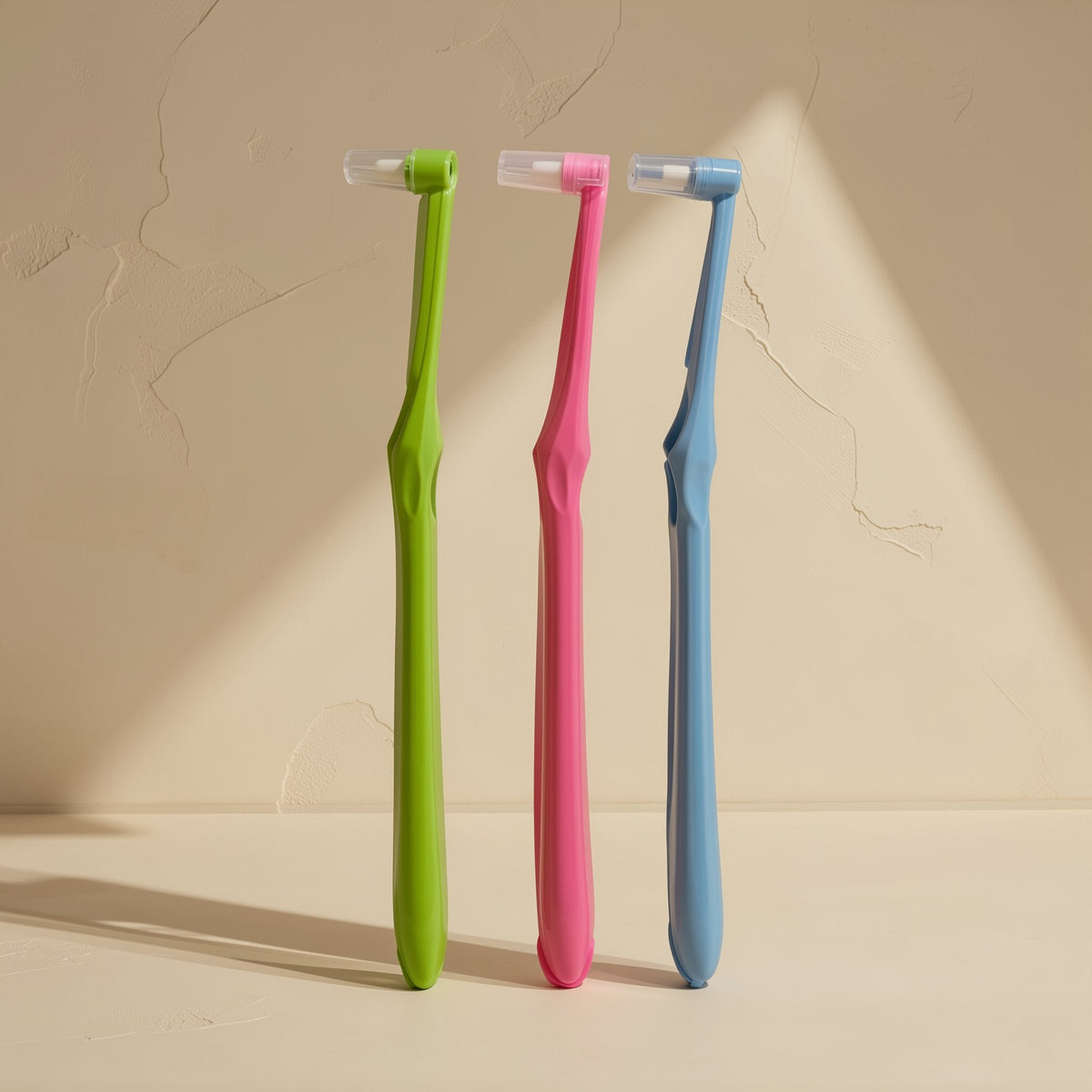 Manual toothbrush with a small tapered single-tuft head and soft bristles