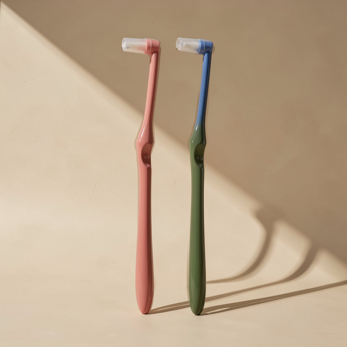 Manual toothbrush with a small tapered single-tuft head and soft bristles - view 3