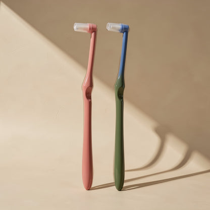 Manual toothbrush with a small tapered single-tuft head and soft bristles - view 3