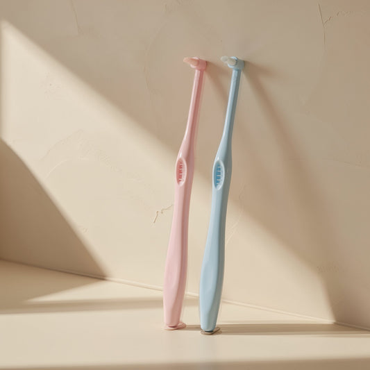 Manual single-head orthodontic toothbrush with pointed soft bristles and a single hole