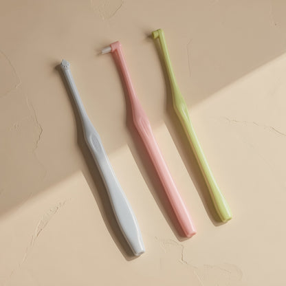Manual single-head orthodontic toothbrush with pointed soft bristles and a single hole - view 2