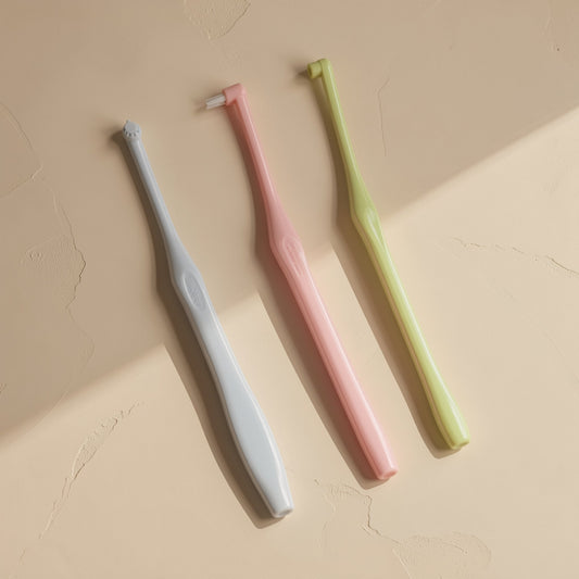 Manual single-head orthodontic toothbrush with pointed soft bristles and a single hole - view 2